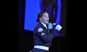 LAPD officer Roslyn Curry sang the national anthem.